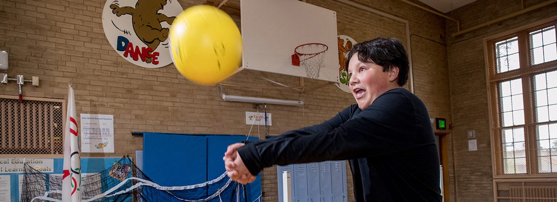 Student playing volleyball